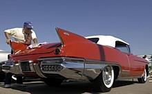 Buddy Brill, of Palm Coast, Fla., polishes his 1958 Cadillac Eldorado Biarritz Convertible during the 2002 Cadillac LaSalle Club National Convention in Dearborn.